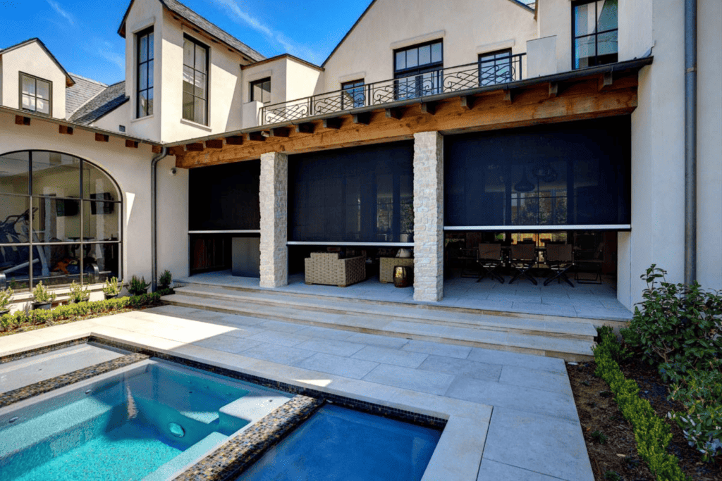 Motorized retractable screen walls on the patio.